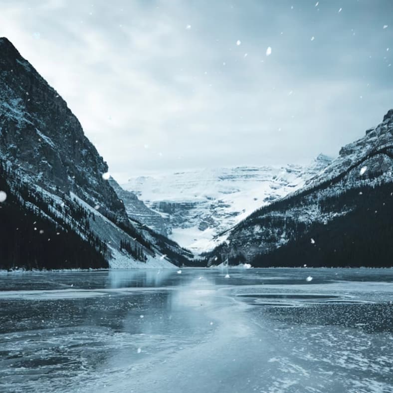 Snowflakes falling on a frozen lake